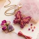 Porte-clés DORÉA Crystal Butterfly Purple Blush fait main en perles acryliques effet cristal violet et rose poudré avec mousqueton doré en acier inoxydable